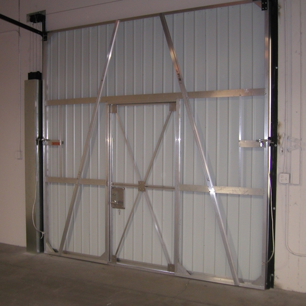 Day & Nite Doors installing a commercial counterweight door