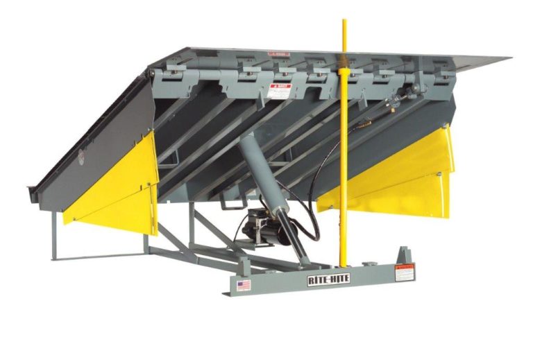 Technician installing a hydraulic dock levelers at a commercial facility in Anaheim, CA